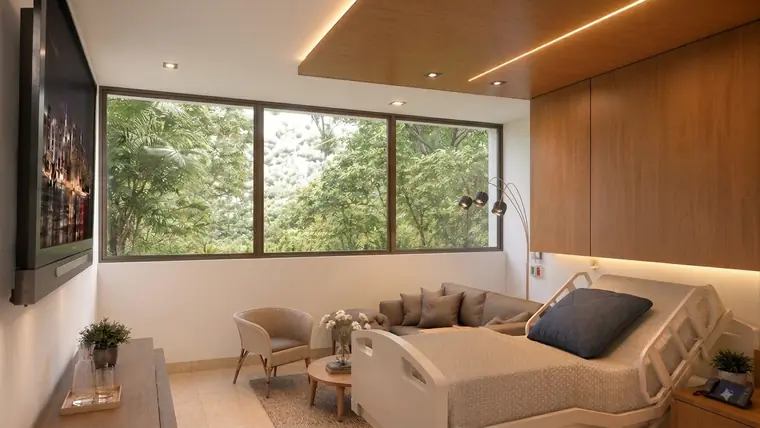 Render de la habitación general: cama hospitalaria y sofá junto a un ventanal